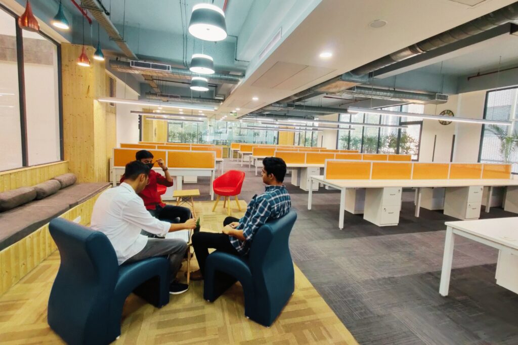 Professionals in a co-working space that supports mental health through a calm and collaborative environment